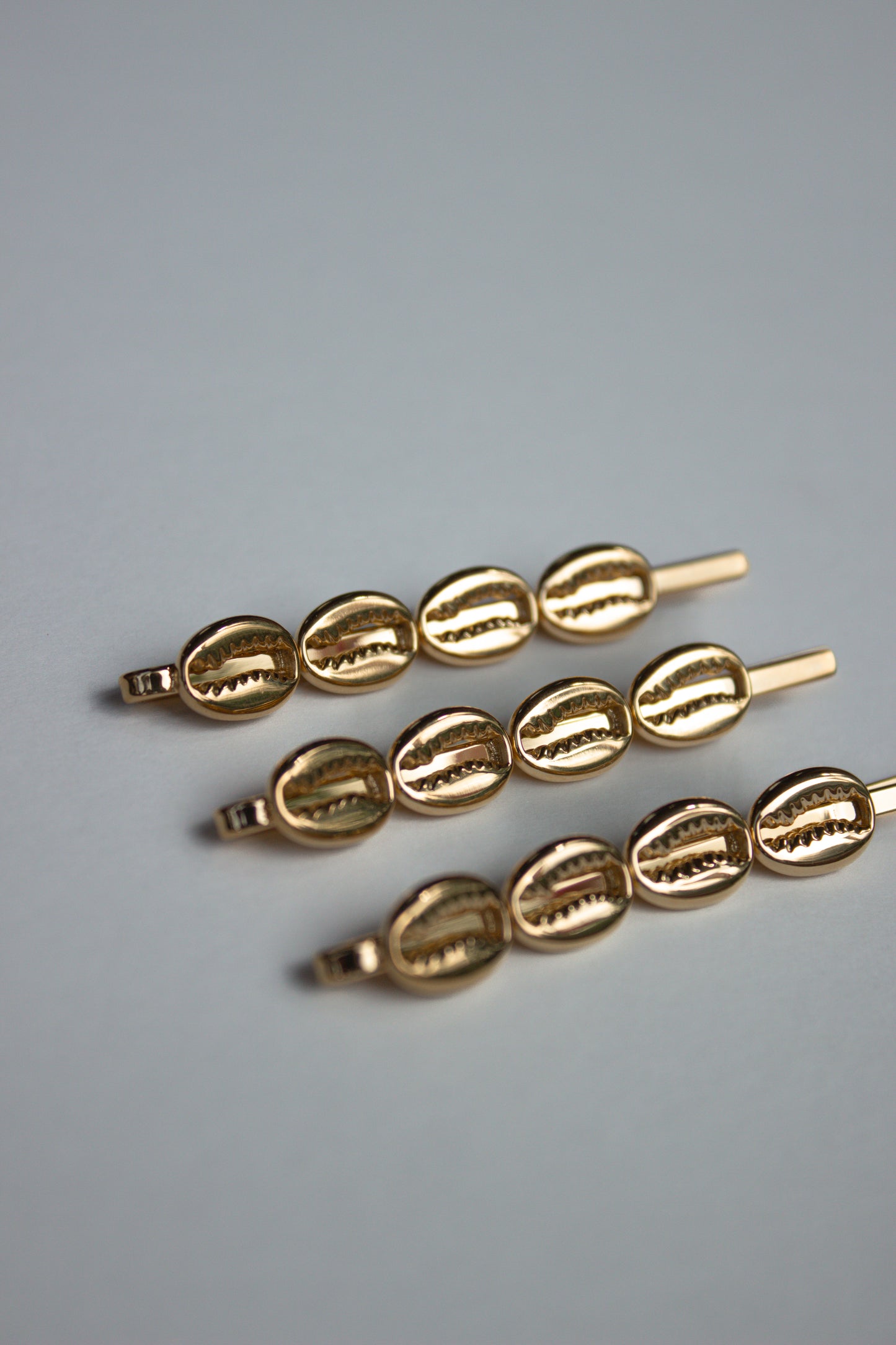 Cowrie Crest Pin
