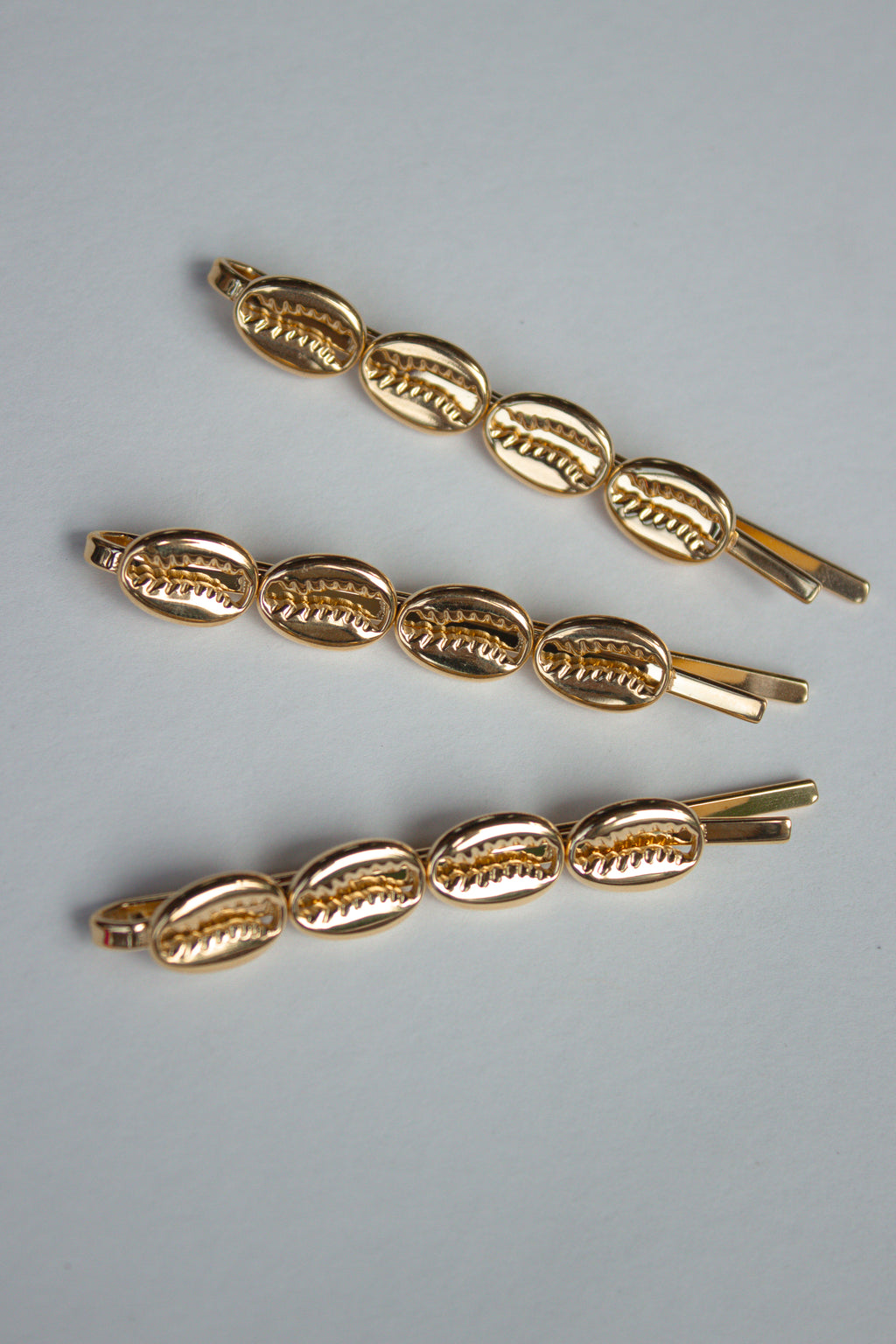 Cowrie Crest Pin