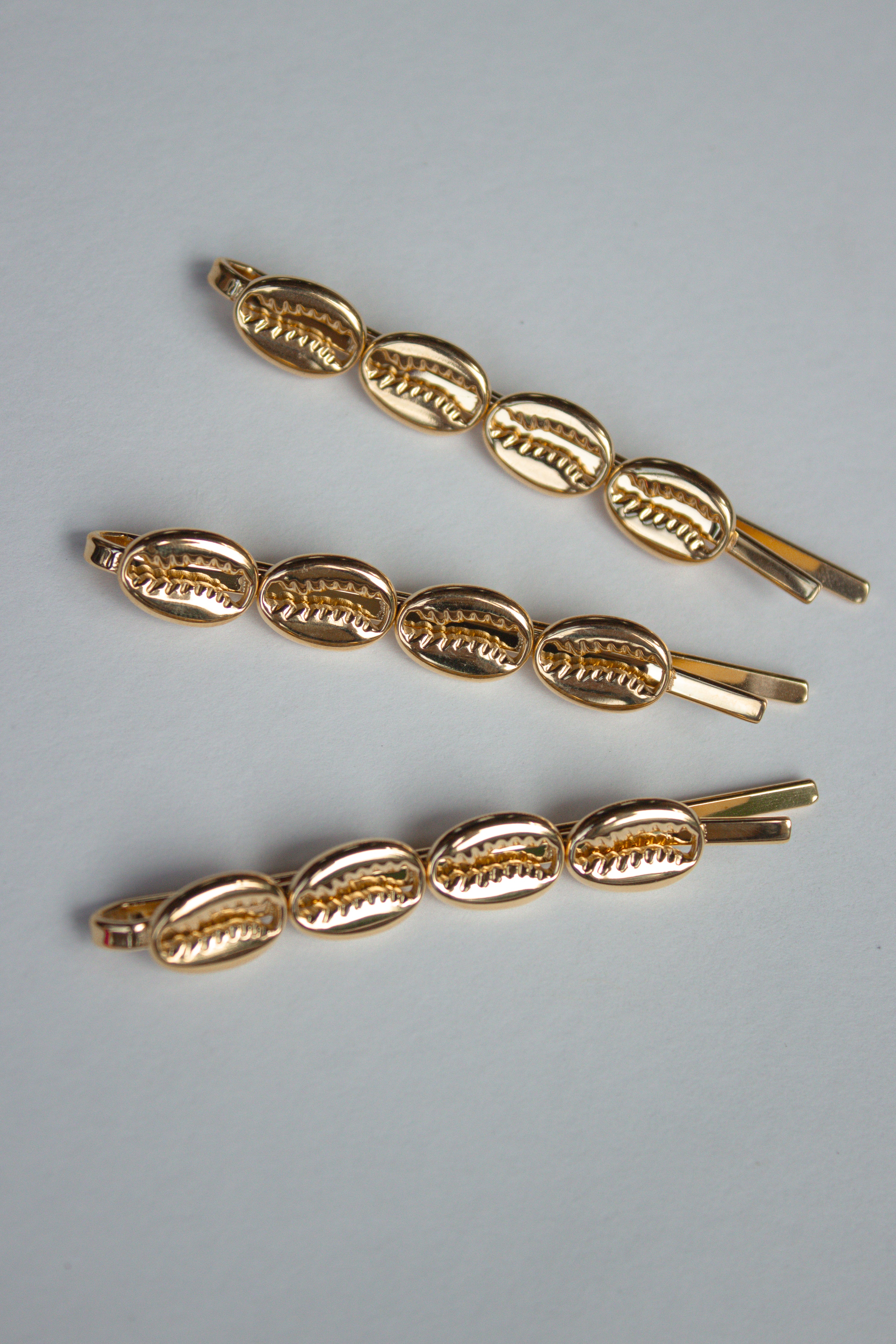 Cowrie Crest Pin